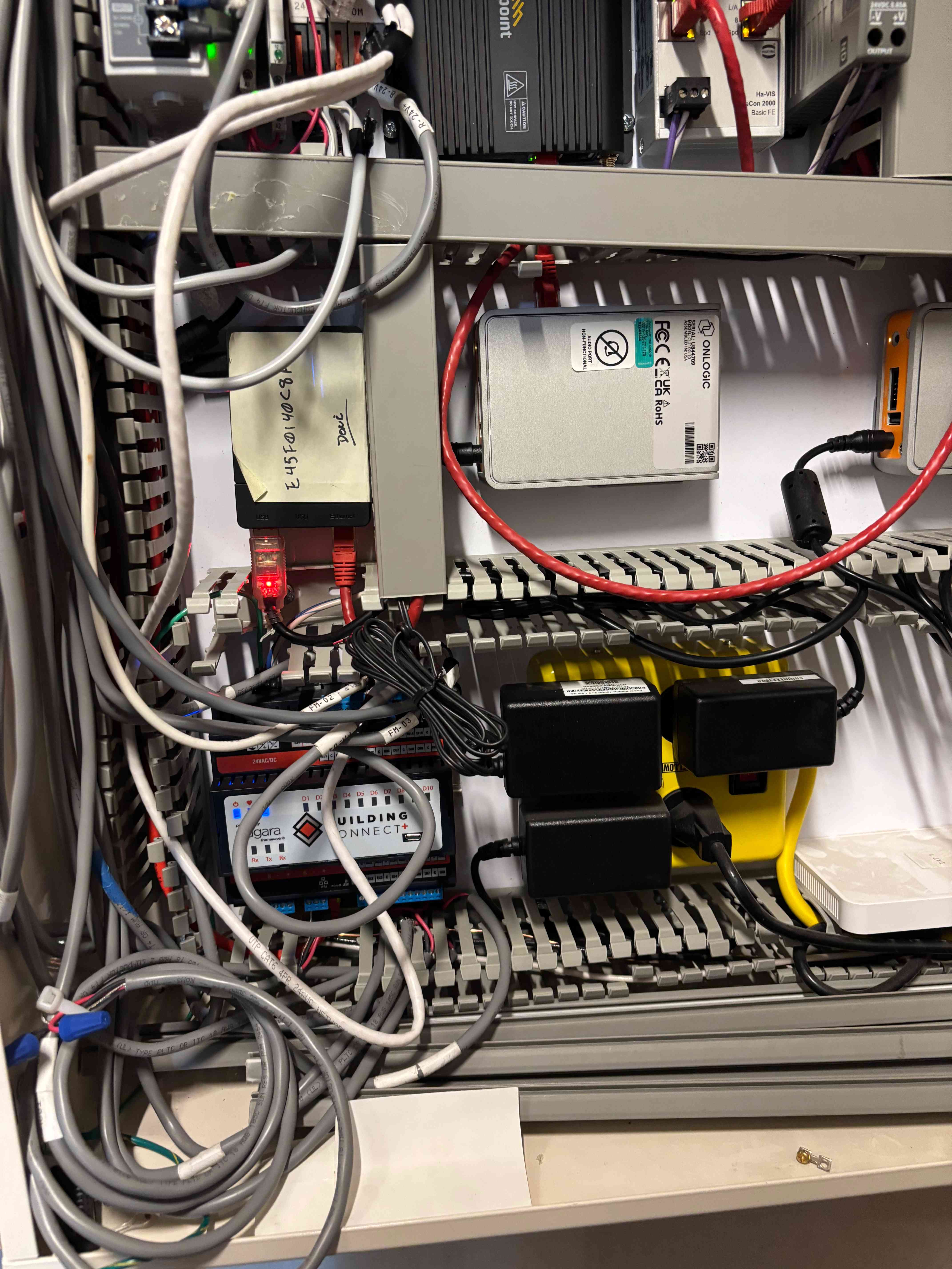 Super SkyBox wired into a building controls cabinet alongside existing building controls hardware